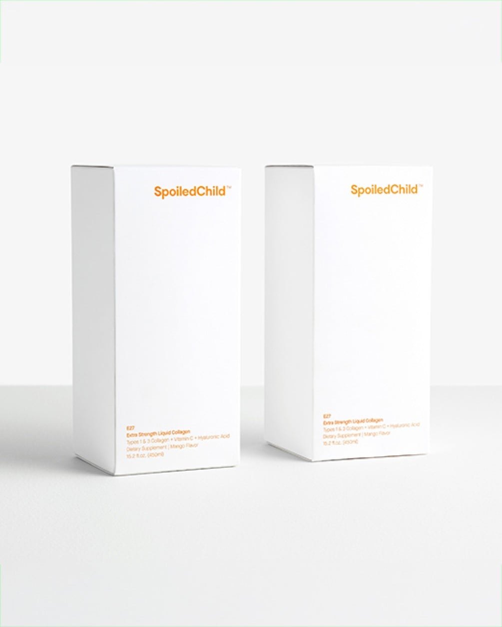 Two white SpoiledChild product boxes with orange text standing side-by-side against a plain white background.