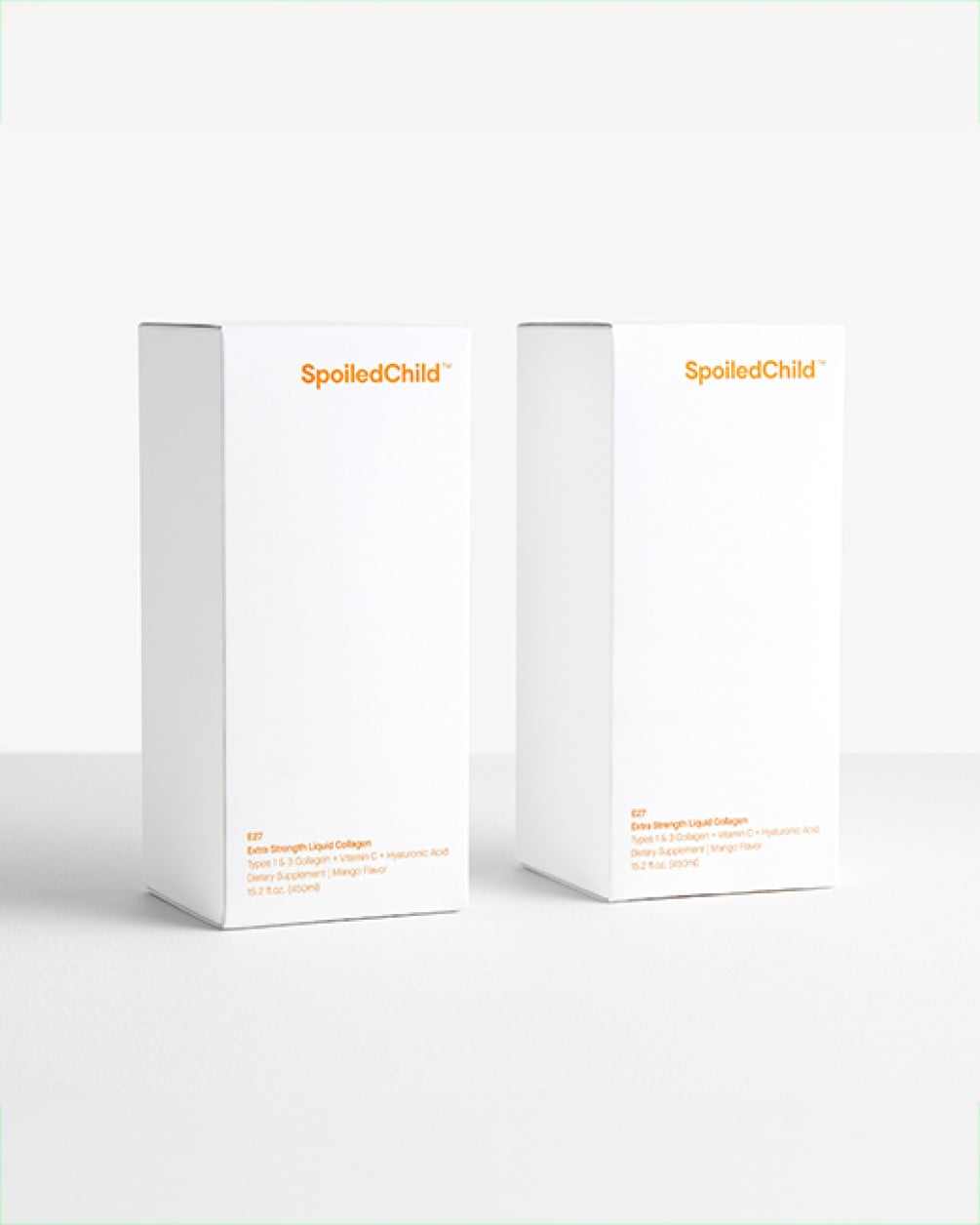 Two white SpoiledChild product boxes with orange text standing side-by-side against a plain white background.