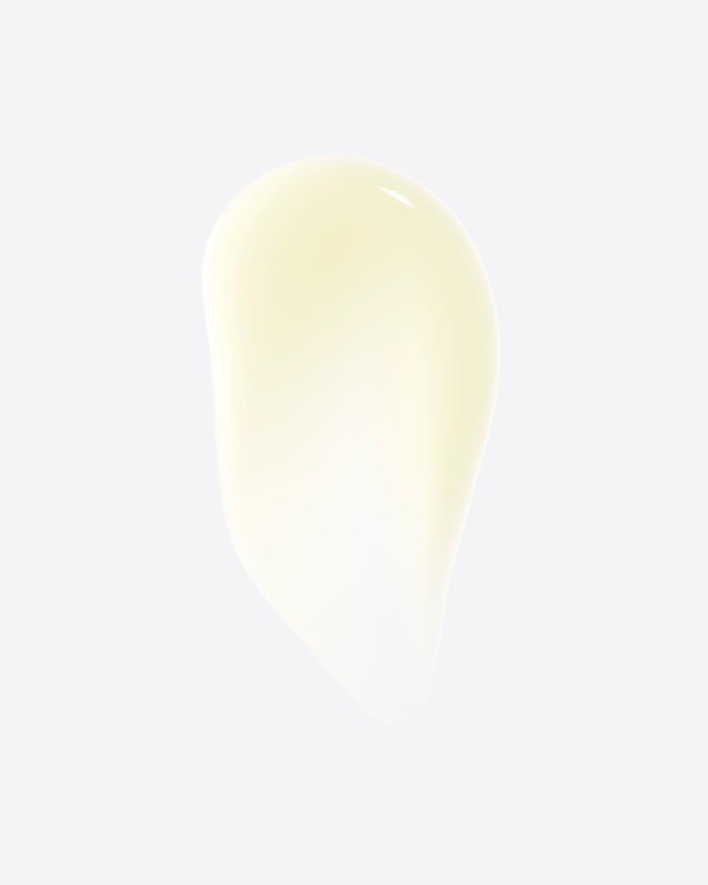 A product texture shot featuring a smooth, teardrop-shaped swatch of a light-yellow serum. The swatch is shown against a clean, white background, highlighting its rich and consistent texture.