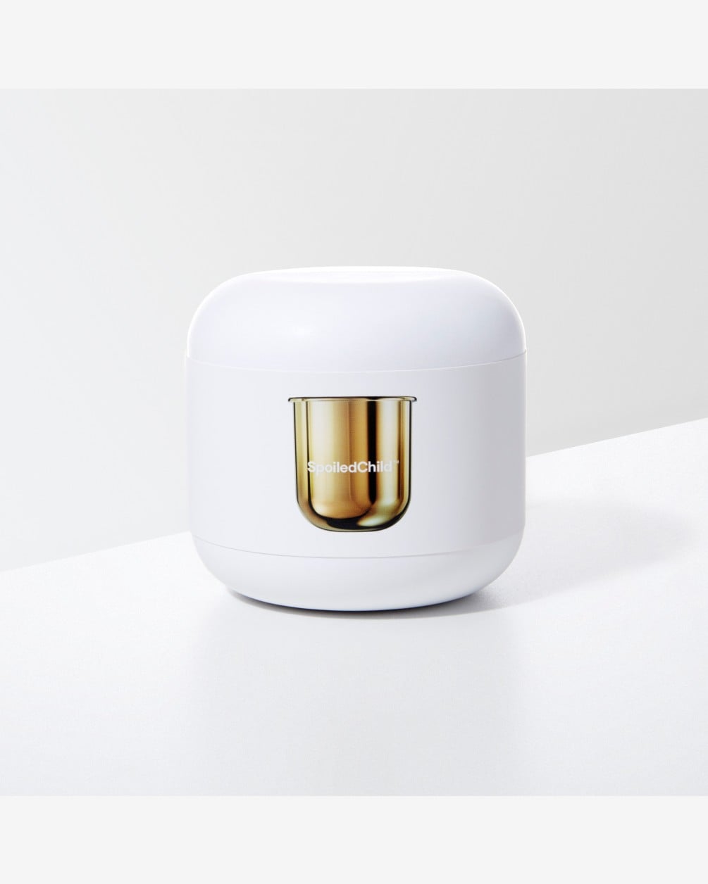 A white, rounded SpoiledChild S24 product box with an illustration of a gold refill capsule on the front, set against a plain white background.
